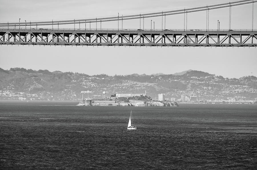 Solitary Sailboat and Alcatraz Island under Golden Gate Bridge Span San Francisco Black and White Photograph by Shawn OBrien