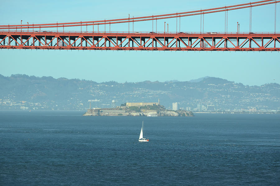 Solitary Sailboat and Alcatraz Island under Golden Gate Bridge Span San Francisco Photograph by Shawn OBrien