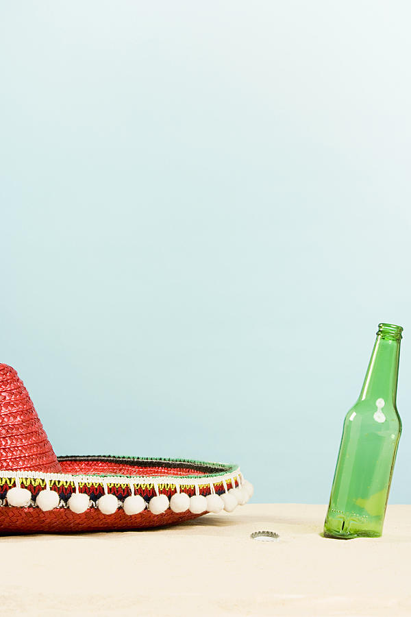 Sombrero and beer bottle Photograph by Image Source