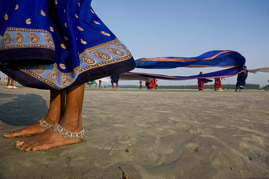 Some Indian pilgrims drying their cloths Photograph by Subir Basak