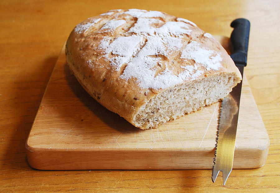 Sourdough on Chopping Board with Knife Photograph by Dragoncello