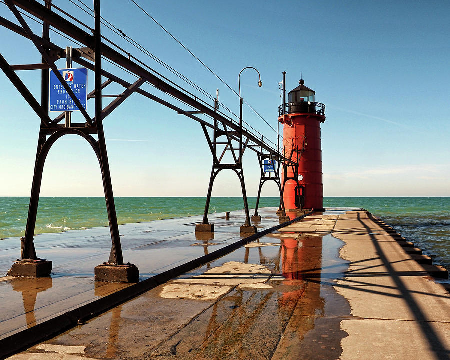 South Haven Pierhead Light Reflection Photograph by Bill Swartwout