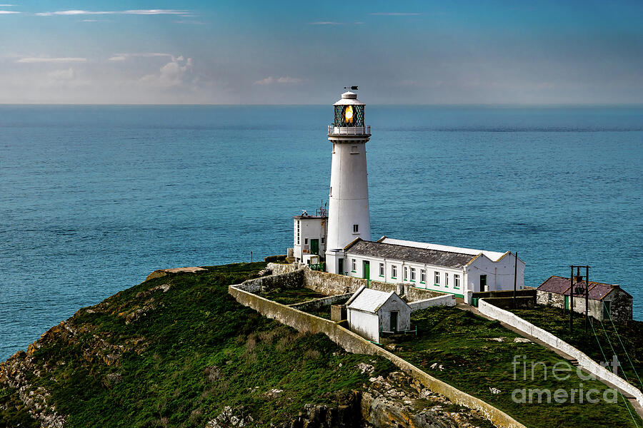 South Stack Island With South Stack Lighthouse And View To The Irish Sea In North Wales, United King Photograph by Andreas Berthold