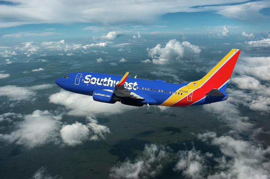 Southwest Airlines Boeing 737 in the Clouds  Mixed Media by Erik Simonsen