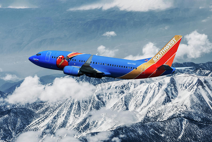 Southwest Airlines Boeing 737 over Snowcapped Mountains Mixed Media by Erik Simonsen