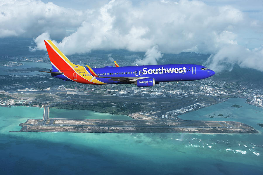 Southwest Airlines over Daniel K. Inouye International Airport Hawaii Mixed Media by Erik Simonsen