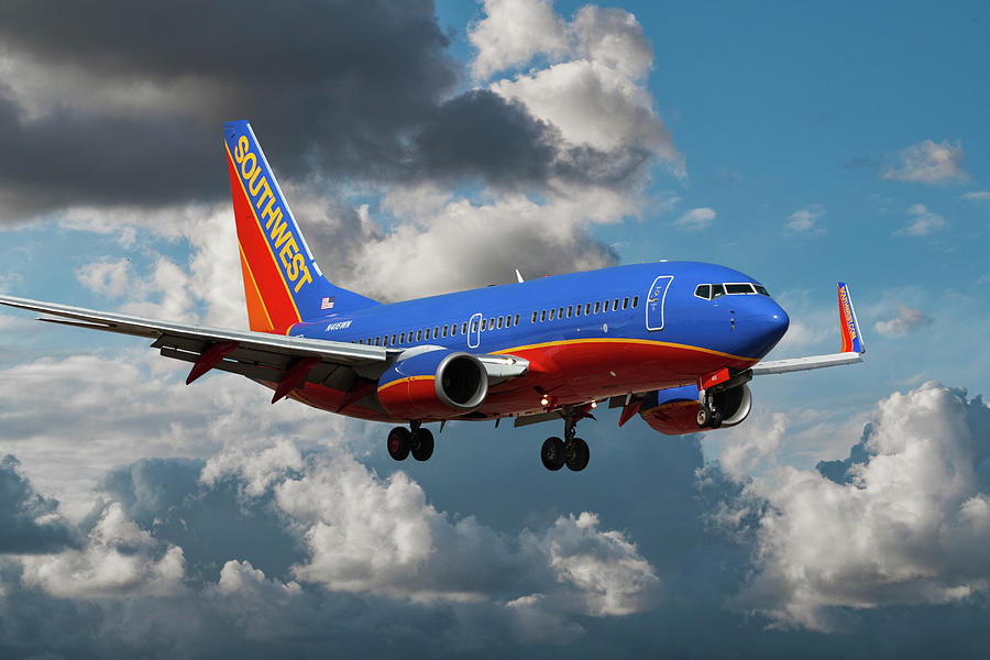 Southwest Boeing 737-7H4 Landing at Orange County Airport Photograph by Erik Simonsen