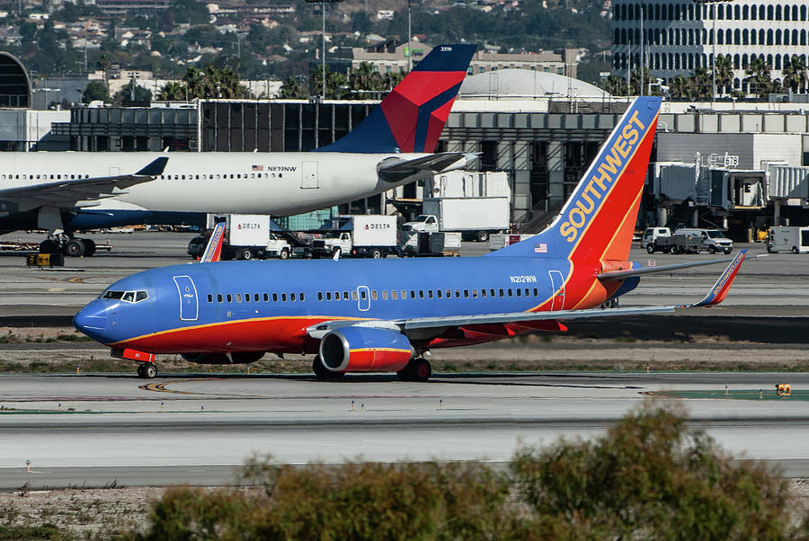 Southwest Boeing 737-7H4 Taxiing at Los Angeles Photograph by Erik Simonsen