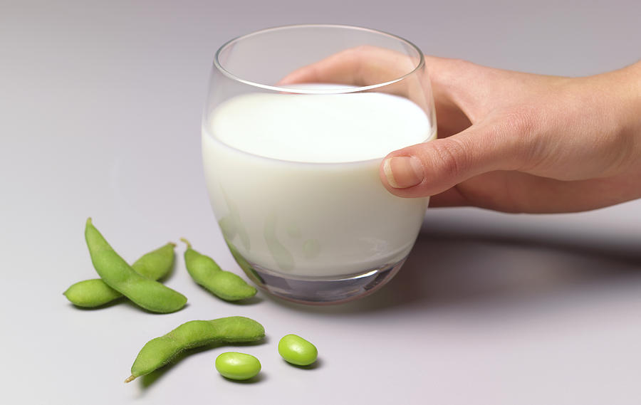 Soya beans and soya milk in glass Photograph by Peter Dazeley