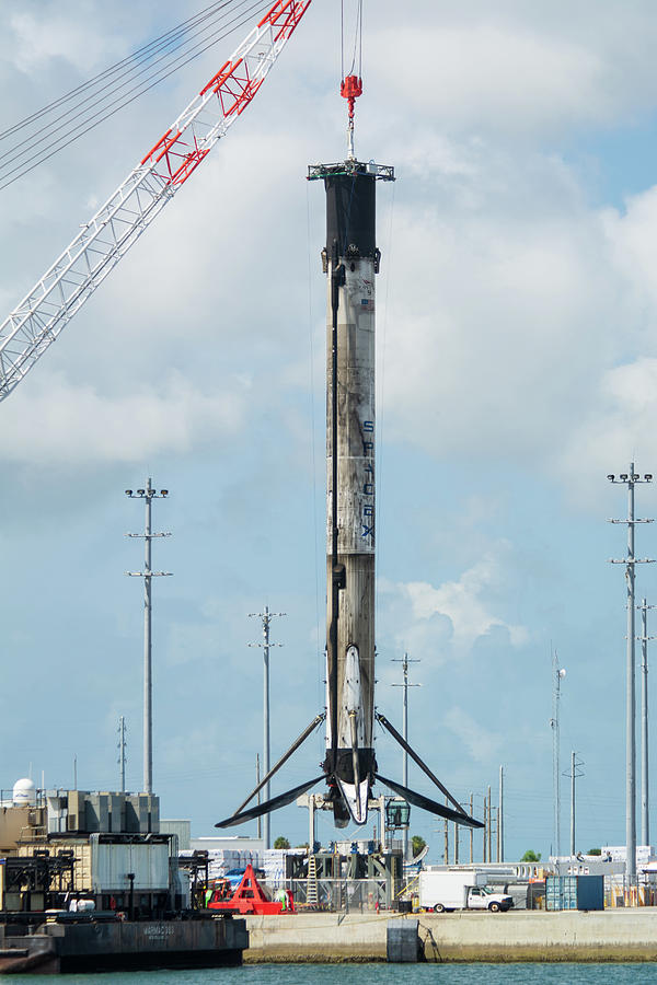SpaceX Rocket hoisted by Crane Photograph by Bradford Martin