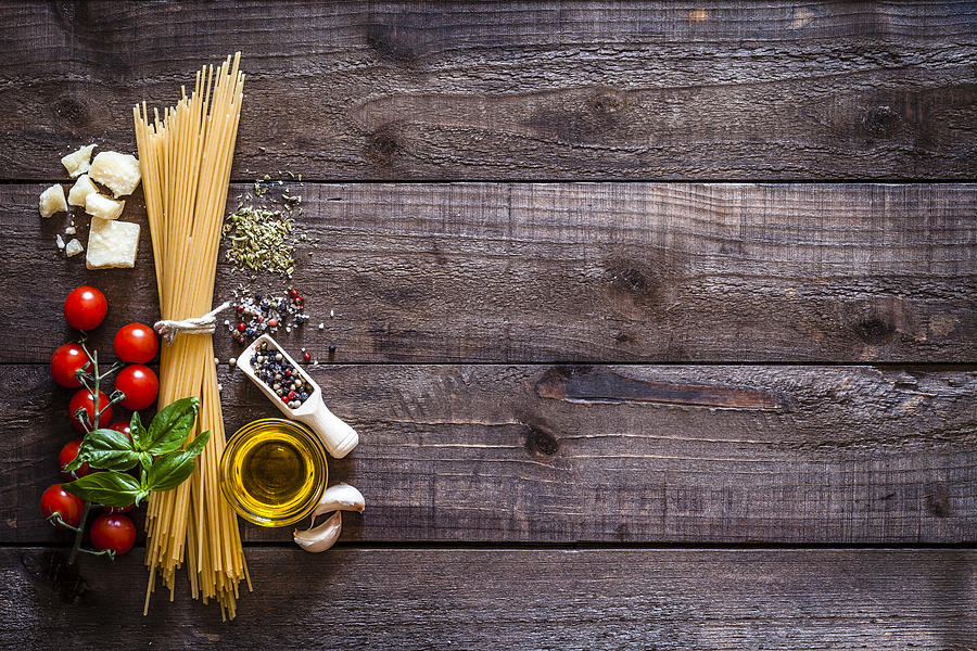Spagetti with ingredients on rustic wooden table Photograph by Fcafotodigital