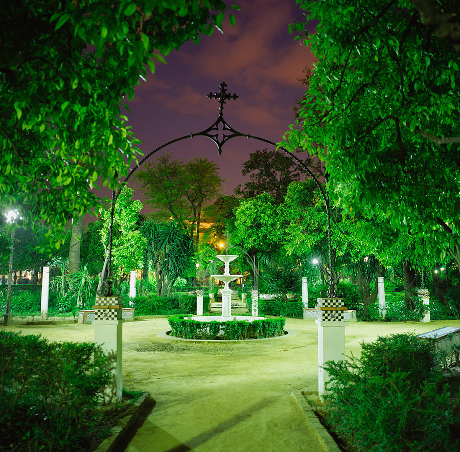Spain, Andalusia, Sevilla, fountain in park, night Photograph by Silvia Otte