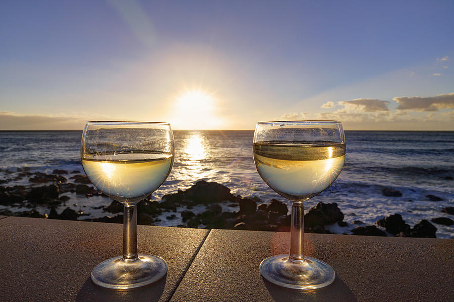 Spain, La Gomera, Glasses with white wine on wall at Valle Gran Rey Photograph by Westend61