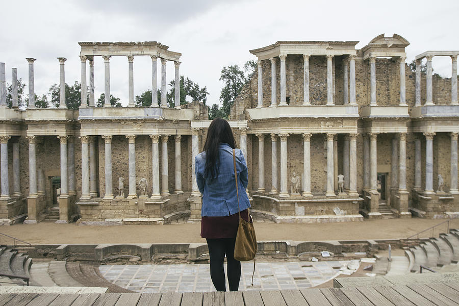 Spain, Merida, back view of woman standing in front of Roman theater Photograph by Westend61