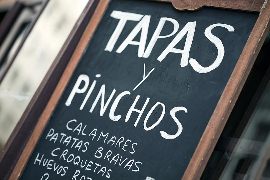 Spanish bar chalkboard featuring tapas y pinchos Photograph by ManuelVelasco
