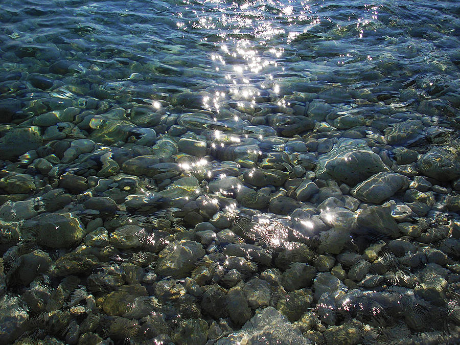 Shiny Sun Sparkles on Crystal Clear Sea Water with Transparent View on Pebbles Photograph by Aneta Soukalova