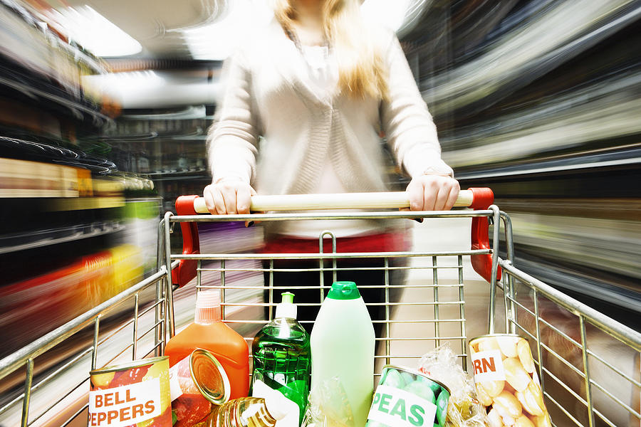 Speed shopping! Racing through supermarket creates extreme motion blur Photograph by RapidEye