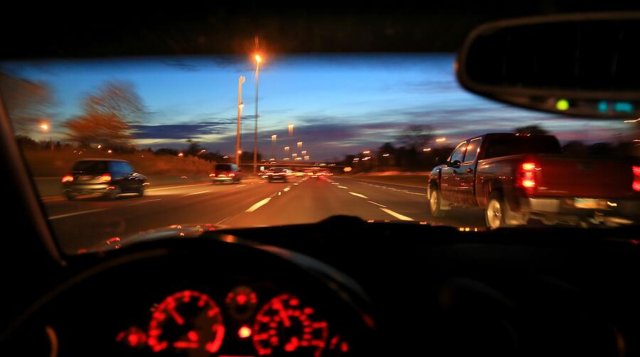 Speeding vehicle on a busy highway Photograph by Douglas Sacha