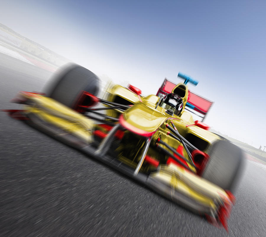Speeding yellow race car Photograph by Jon Feingersh Photography Inc