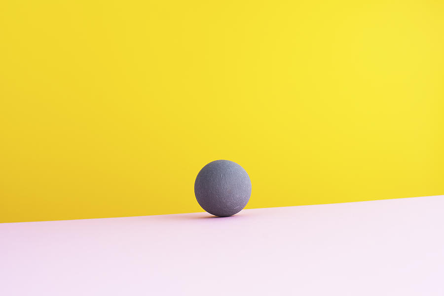 Sphere against yellow background, 3D Rendering Drawing by Westend61