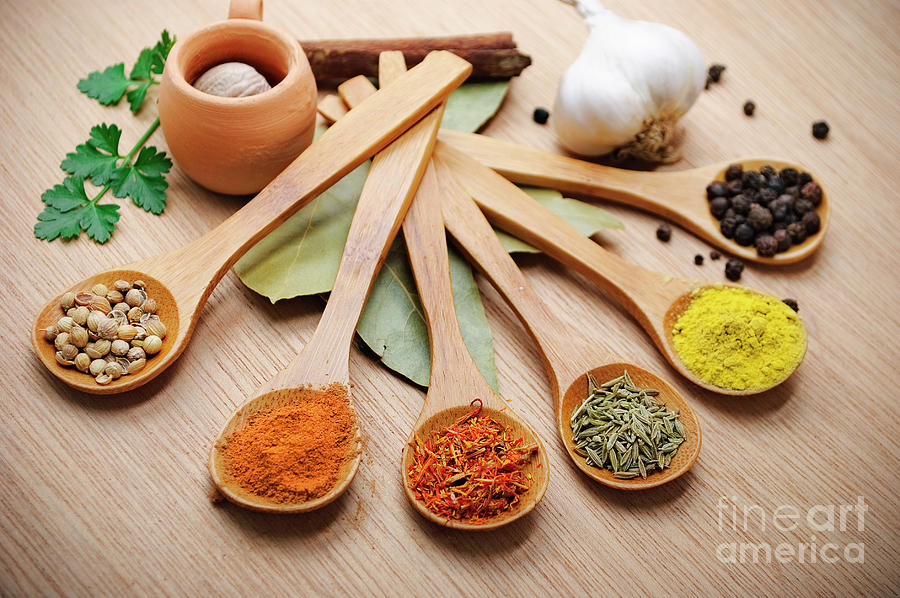 Spices in wooden spoon Photograph by Jelena Jovanovic