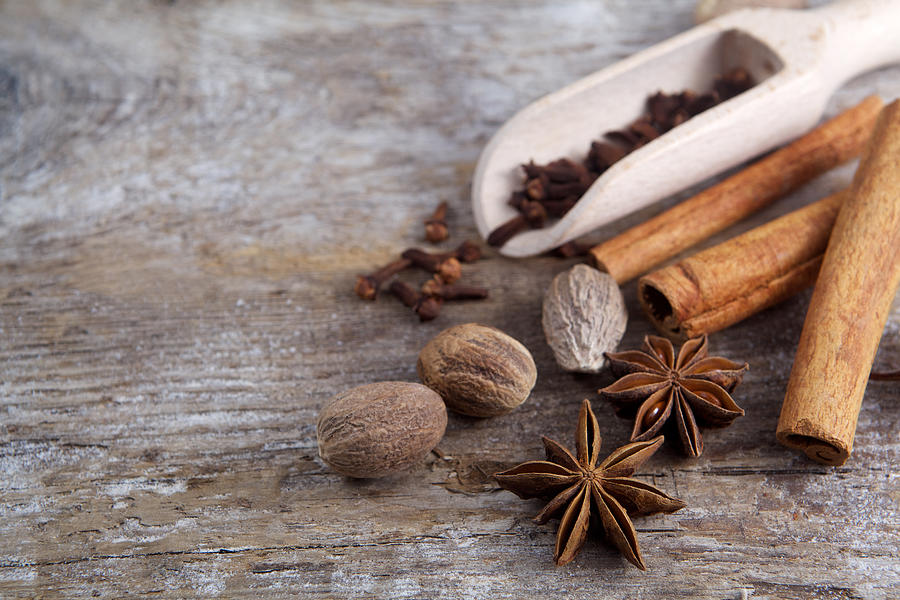 Spices on wooden background. Photograph by Nambitomo