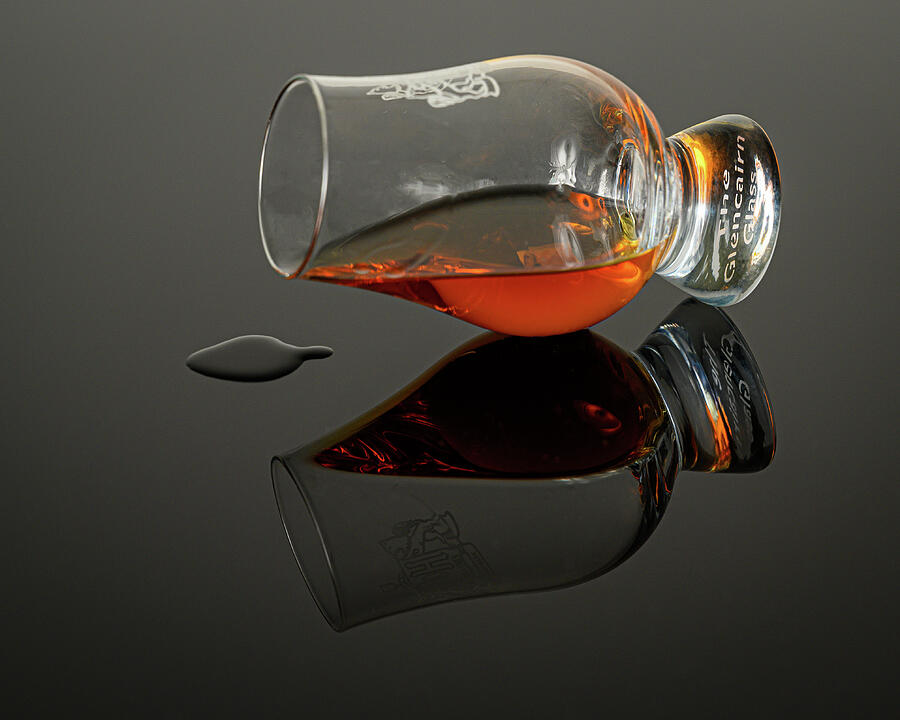 Spilled bourbon in glen cairn glass Photograph by Mike Worley Spilled bourbon in glen cairn glass Photograph by Mike Worley
