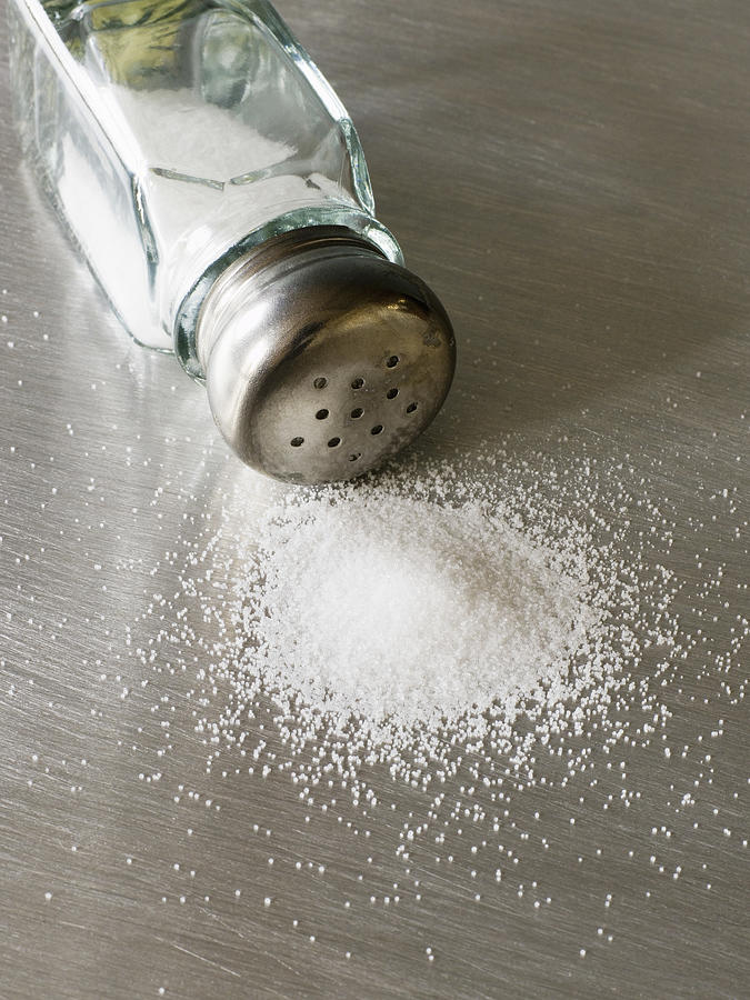 Spilled salt shaker Photograph by Thinkstock Images