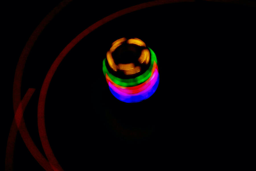 Abstract Photograph - Spinning top and light trails ll. by Joe Vella