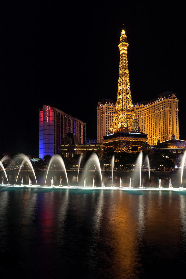 Splendiferous Las Vegas Fountains - Dainty Jets with Paris Eiffel Tower and Ballys at Midnight Photograph by Georgia Mizuleva