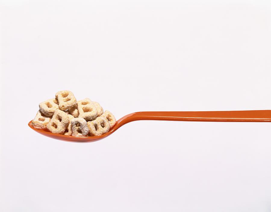 Spoon with cereal shaped like a B Photograph by Brian Hagiwara