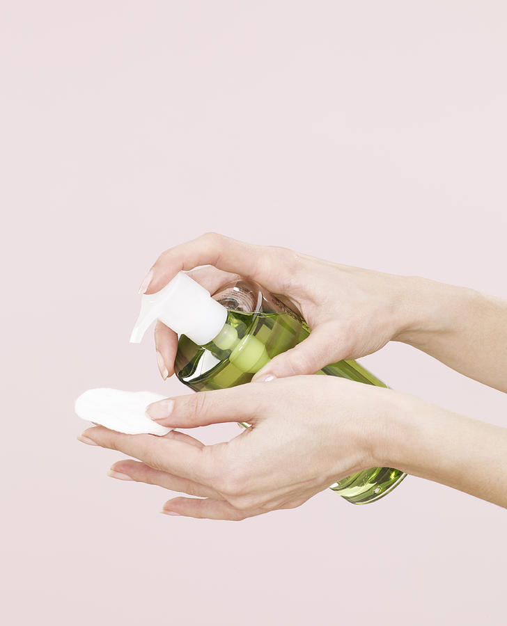 Squirting Make Up Remover Onto Cotton Pad Photograph by Oppenheim Bernhard