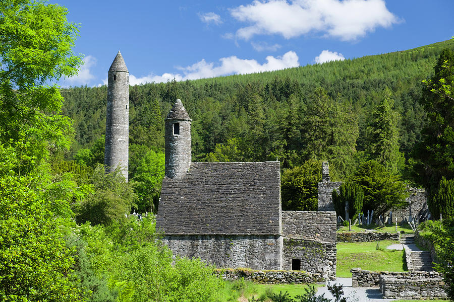 St. Kevins church and Round Tower Glendalough Photograph by David L Moore