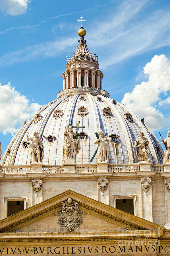 St. Peters Basilica Cathedrals dome with a beautiful sky in the background.  Photograph by Gunther Allen