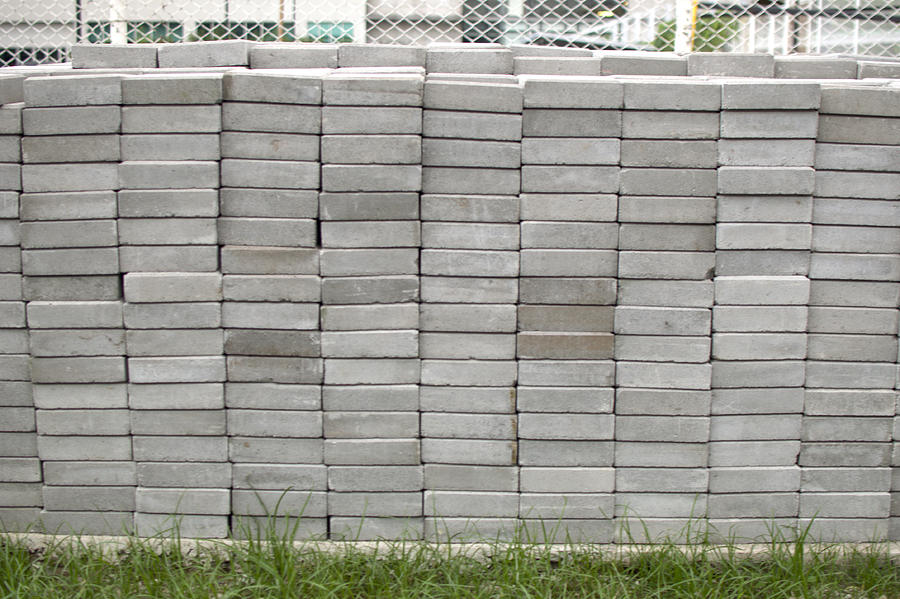 Stack of concrete bricks outdoor Photograph by Karl Tapales
