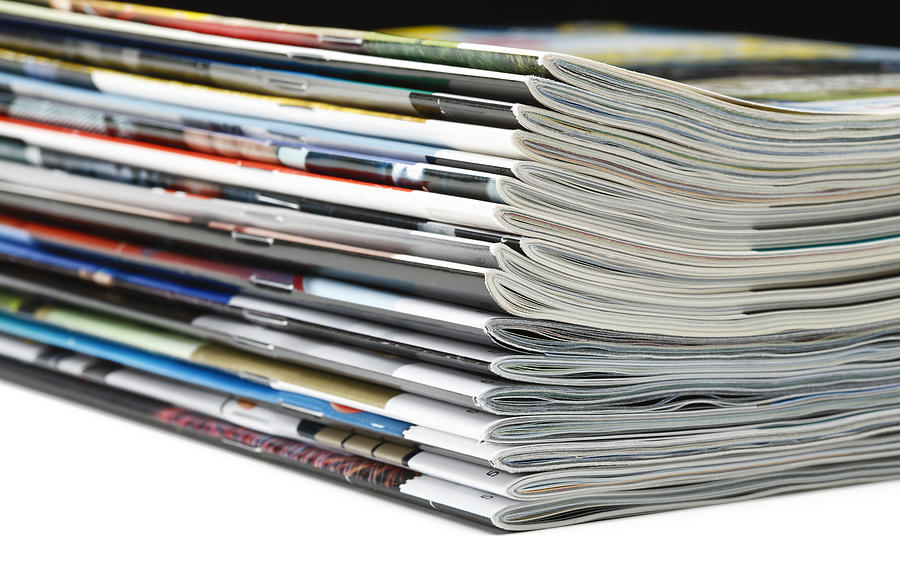 Stack of magazines Photograph by Photoevent