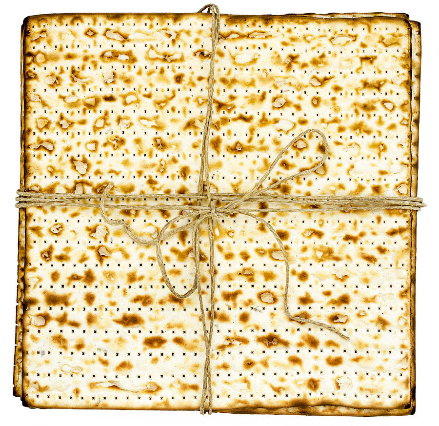 Stack of matzah or matza on white isolated background presented as a gift Photograph by Vlad Fishman