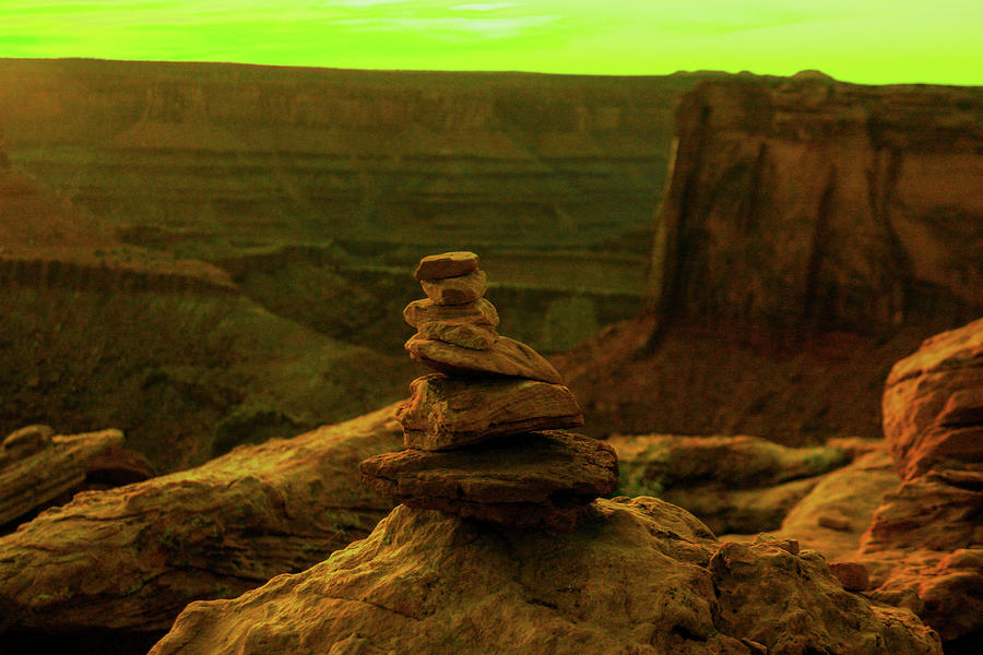 Stack of rocks and a Canyonland viewpoint Photograph by Jeff Swan
