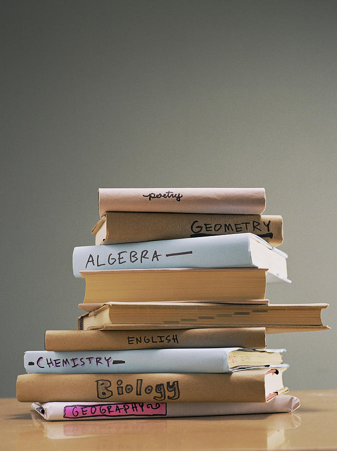 Stack of text books Photograph by Jupiterimages