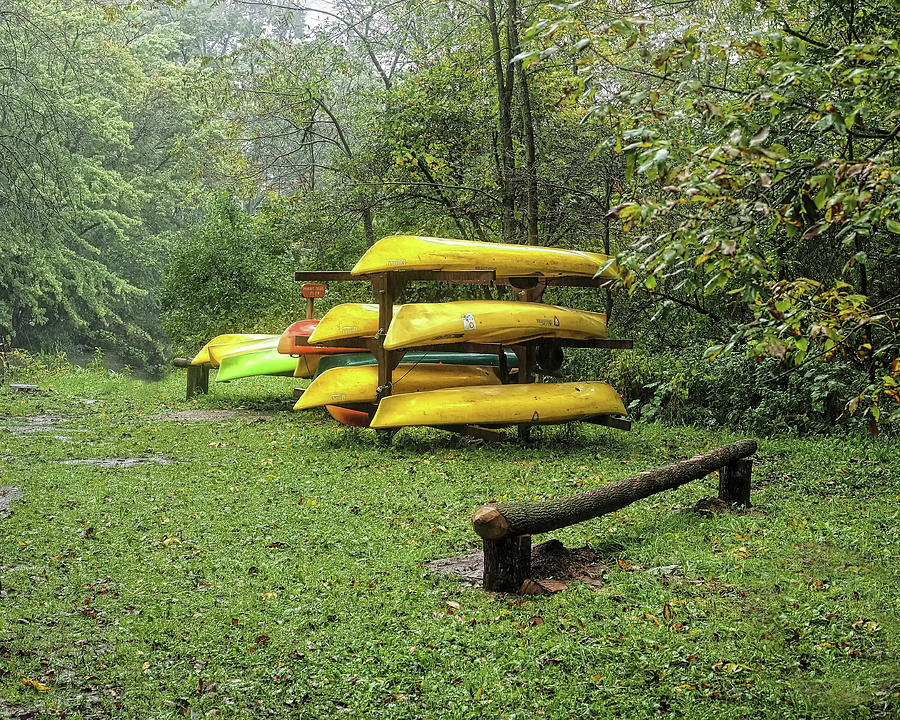 Stacked Canoes Photograph by Scott Olsen