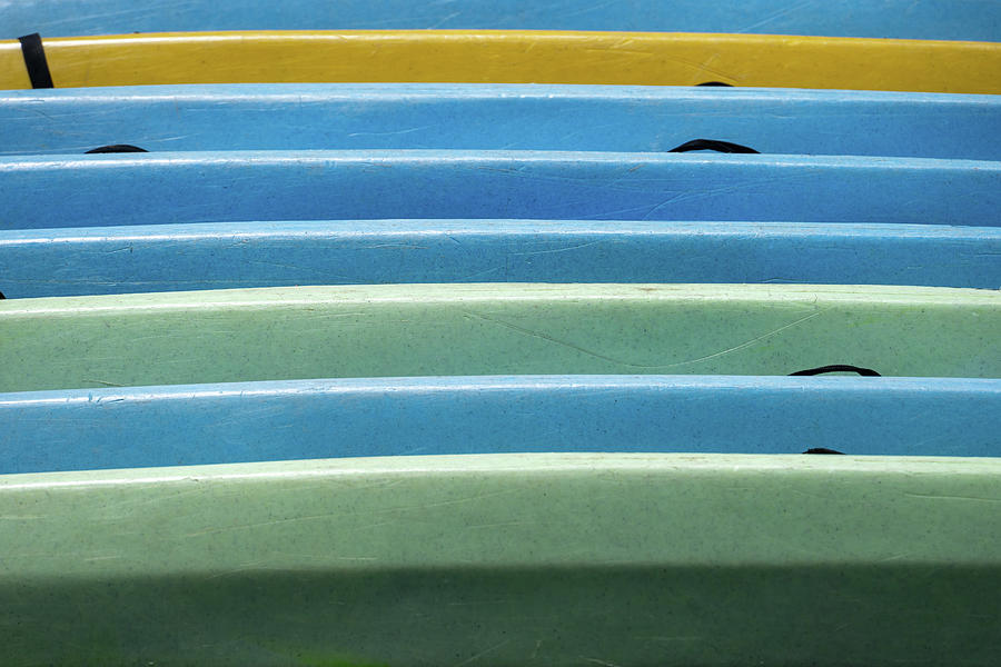 Stacked Colorful Kayaks Photograph by Tina Horne