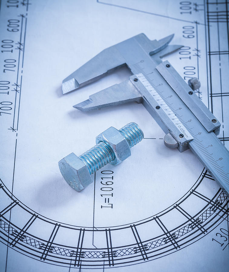 Stainless bolt with screw nut roller bearings on blueprint const Photograph by Mihalec