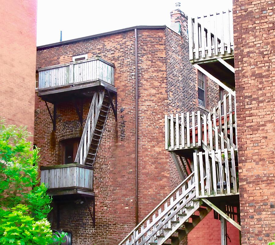 Stairs and balconies Photograph by Stephanie Moore