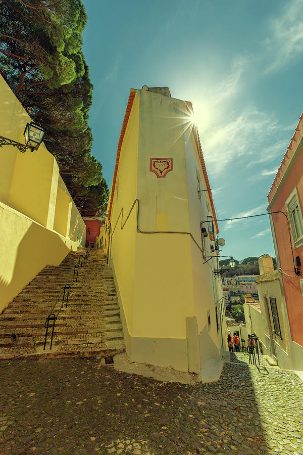 Stairs on small street in Alfama Lisbon Photograph by Mikhail Kokhanchikov