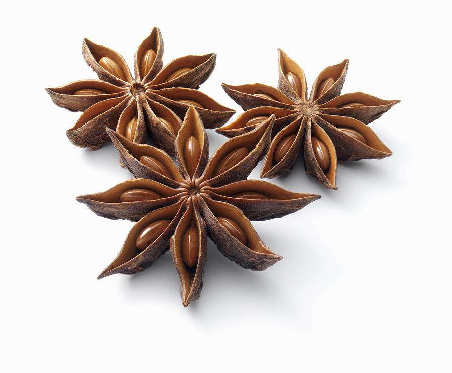 Star anise on a white background Photograph by Stuart Minzey