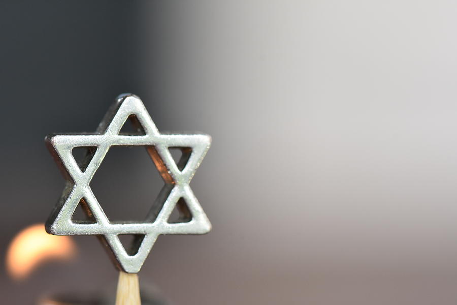 Star of David on a candle background Photograph by tzahiV