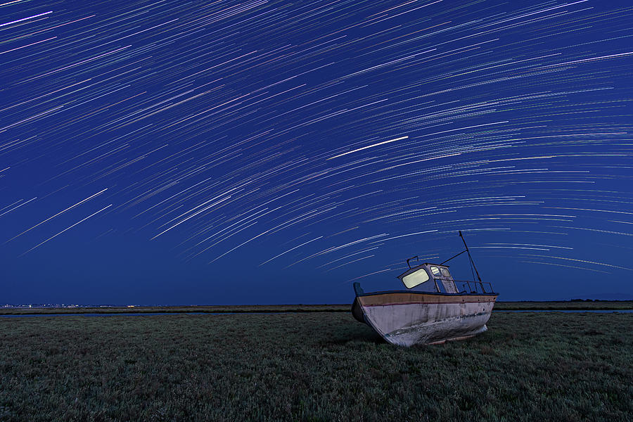 Star Trails over an old boat Photograph by Alexios Ntounas