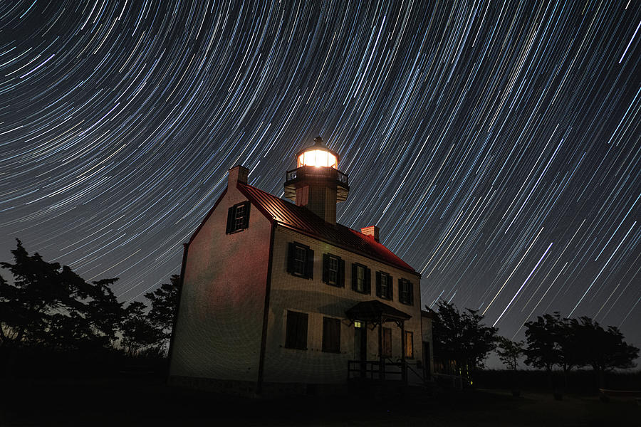 Star trails over East Point Lighthouse Photograph by Daniel Adams