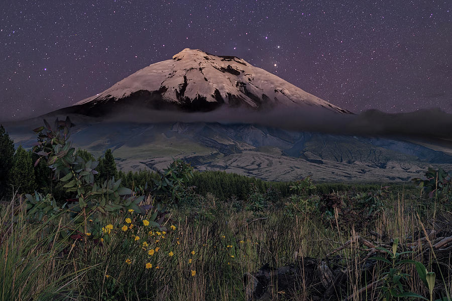Starry night above the west face of the Cotopaxi volcano Photograph by Henri Leduc