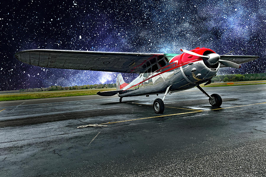 Stary Night Sky with a Cessna Businessliner Photograph by Bill Swartwout